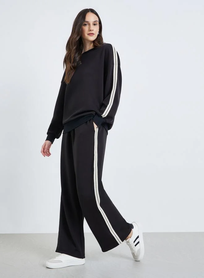 Styli Women Black Wide Leg Joggers with Stripe Detail